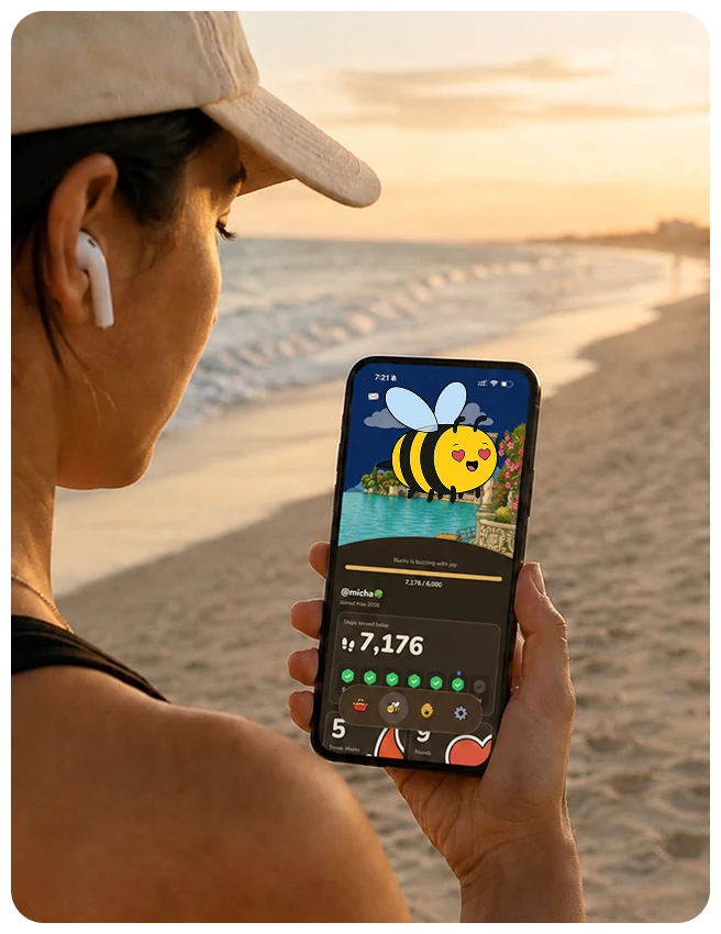 Woman on a sunset beach walk checking her step count in the BuzzBuzz app